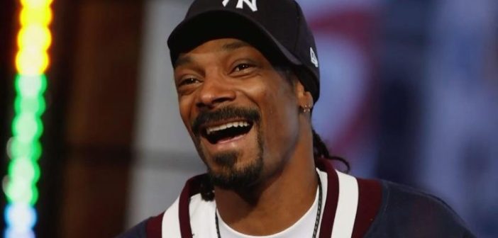 Snoop Dogg in a hcokey team hat