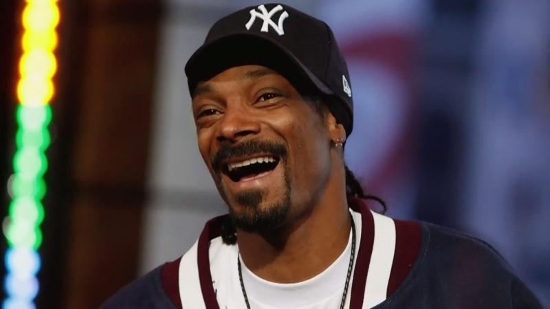 Snoop Dogg in a hcokey team hat